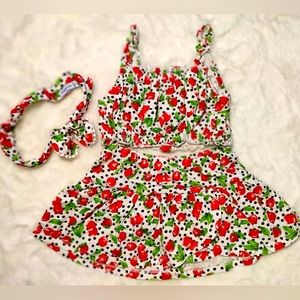 Baby girl matching belly tank and skirt set with headband.